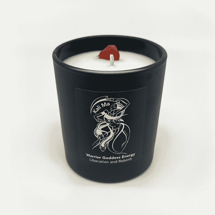 Black candle jar Kali Ma with a white candle inside, featuring a logo and text on a white background