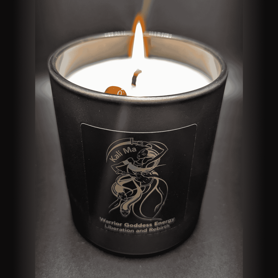 Black candle with a label on a dark background
