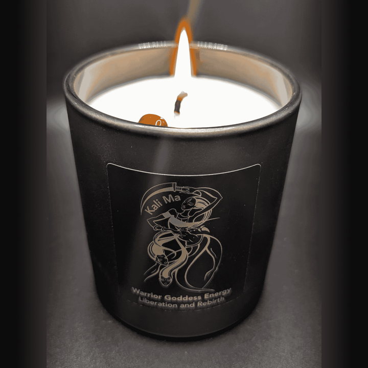 Black candle with a label on a dark background