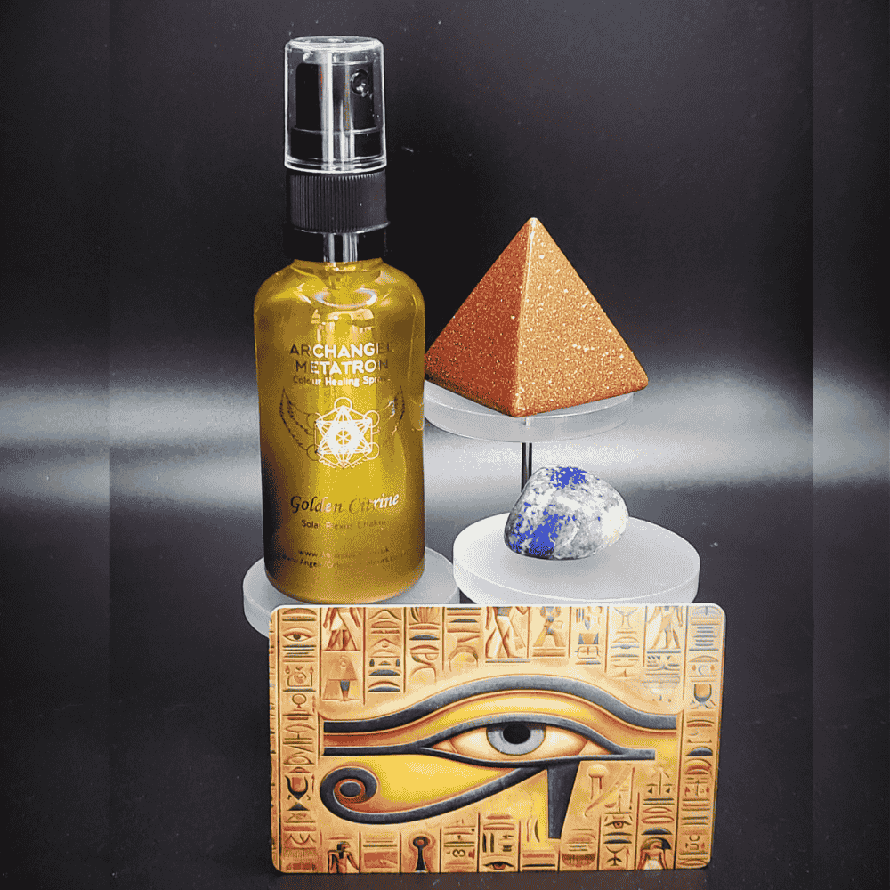 Bottle of Golden citrine spray with pyramid, crystal, and eye of Horus design on a black background